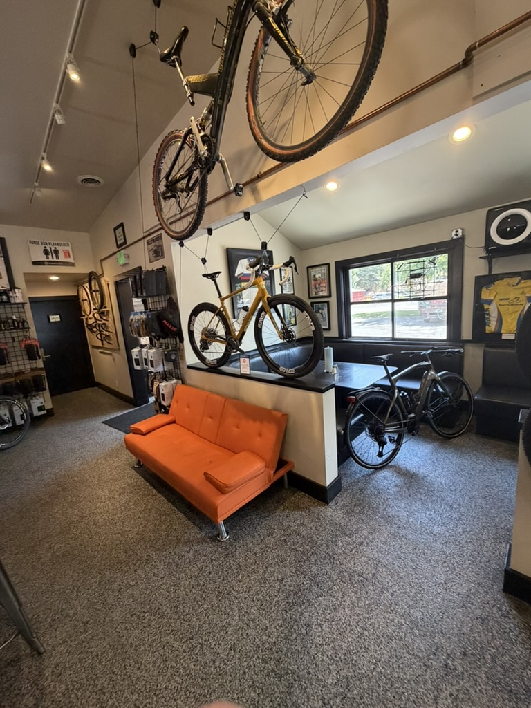 Power House bike shop interior with display bikes and orange couch